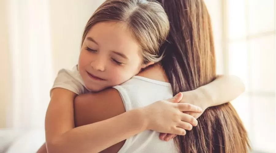 A daughter hugging her mother